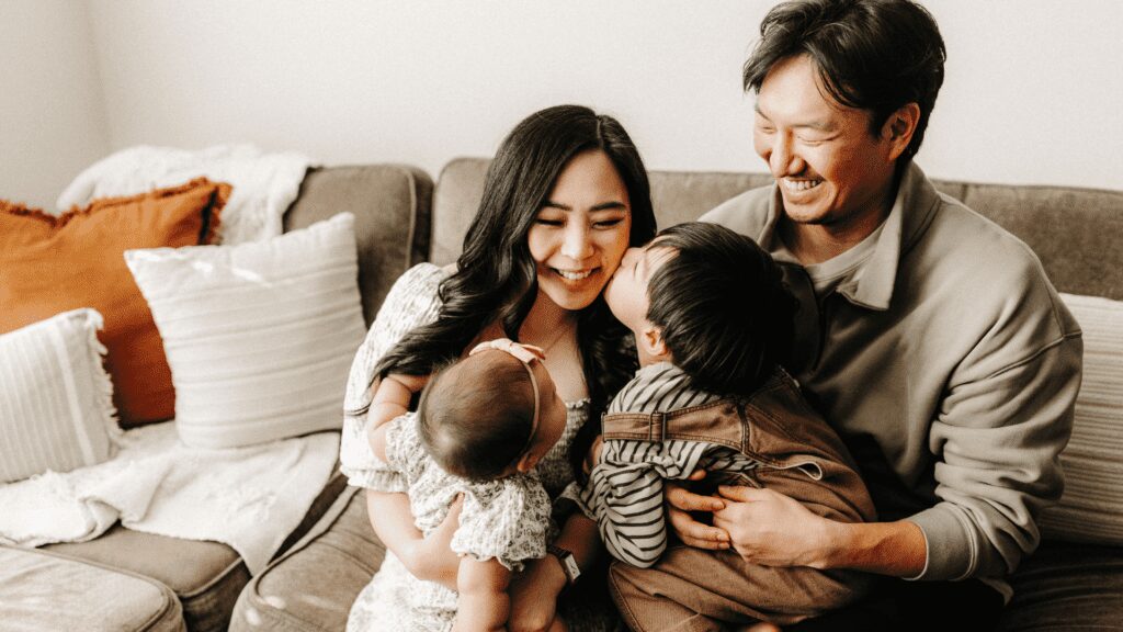 Candid shot of a family on the sofa
