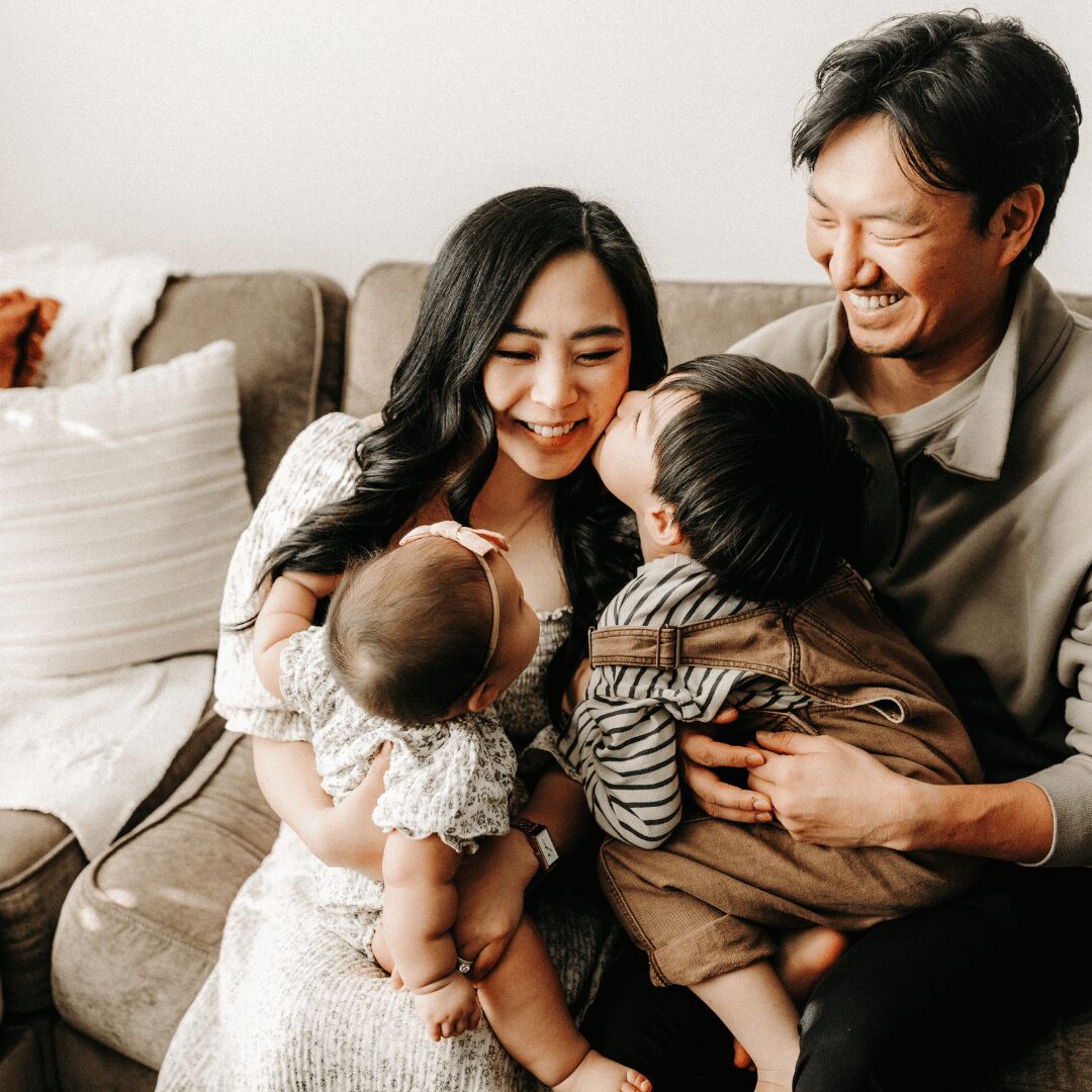 Candid shot of a family on the sofa